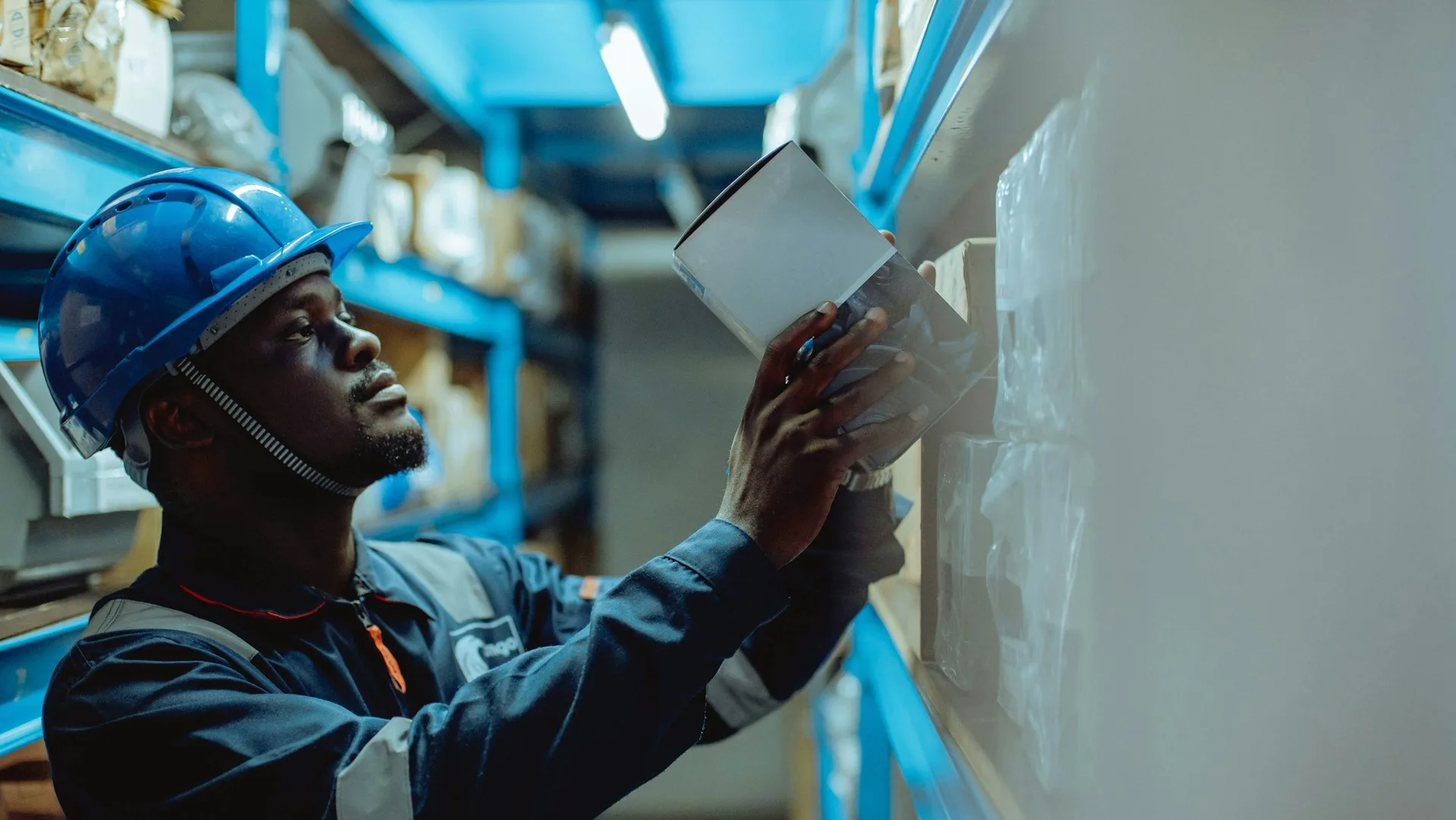 Technician conducting a technical equipment inspection in a warehouse